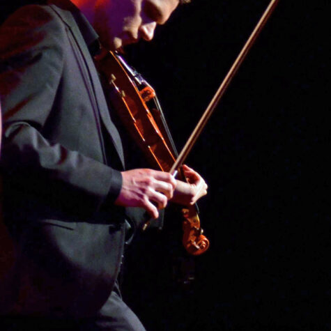 Mads with violin looking down - by John Tinger